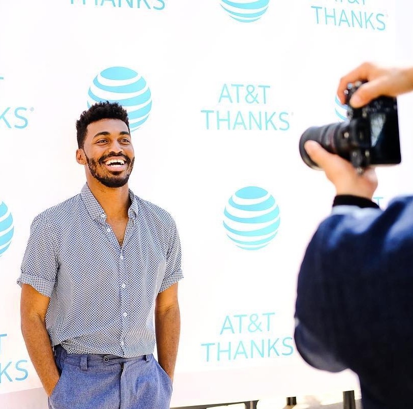 man having photo taken at AT&T event